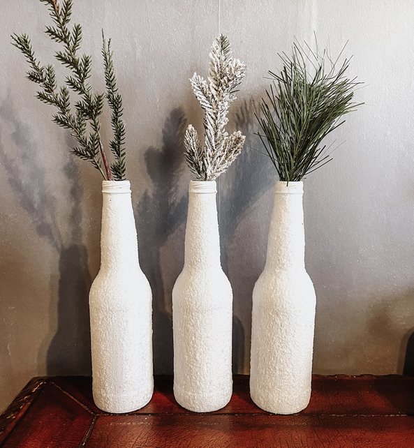 Faux snow covered vases